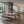 Modern living room with a pool table and seating area